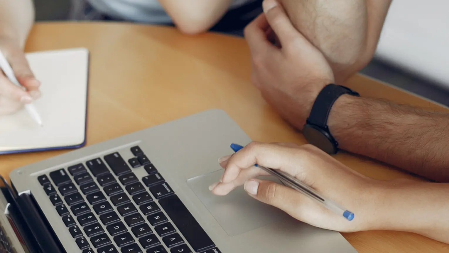 People applying for Summer Internships on a laptop taking notes